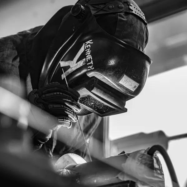 RCM Metal Works welder fabricating custom metalwork in Murray, Utah