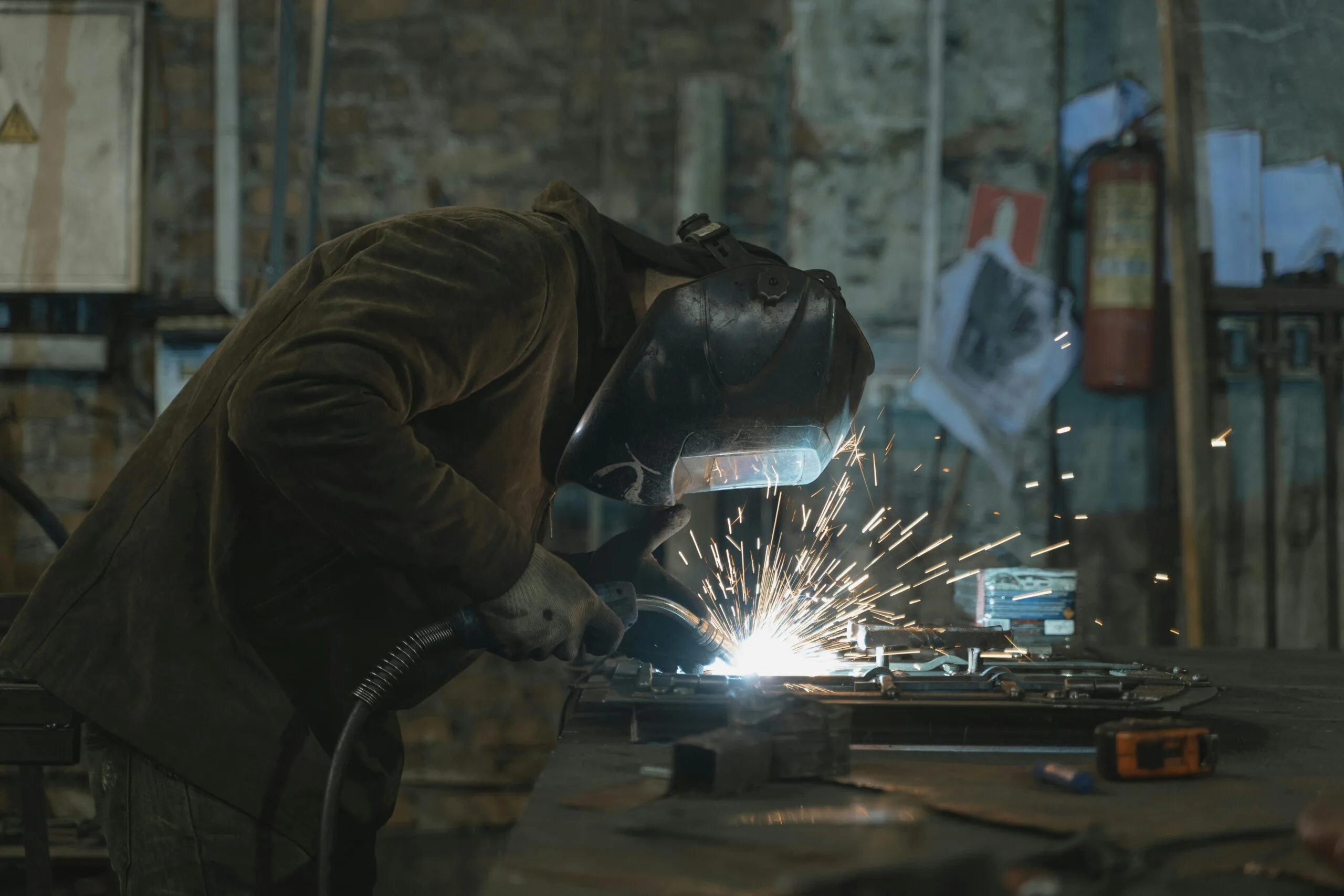 Welding sparks in the RCM Metal Works fabrication shop